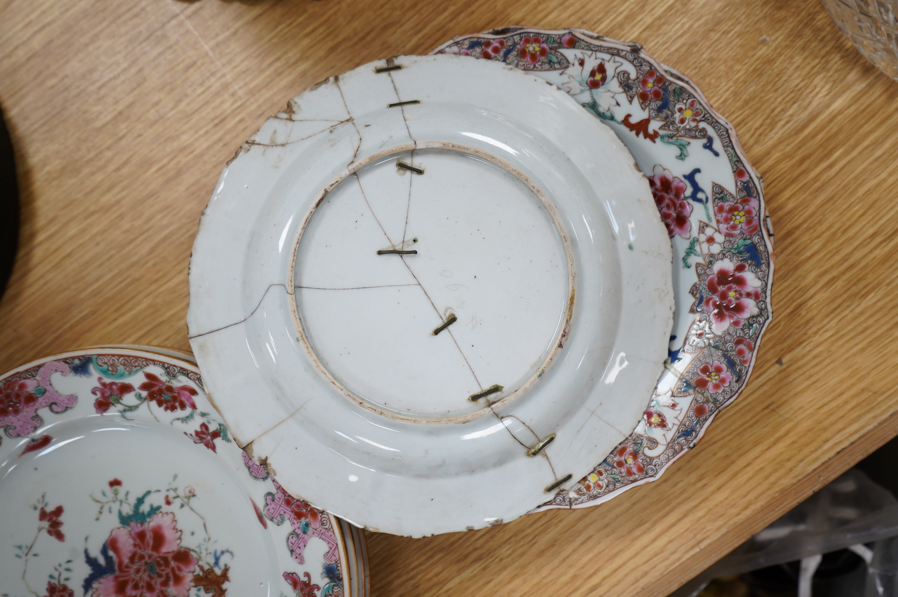 A set of five Chinese porcelain famille rose dishes, diameter 22.5cm, and three others (8). Condition - poor, significant damage to many.